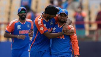 Arshdeep Singh celebrates with Kuldeep Yadav after completing a catch to dismiss Matthew Wade during India's T20 World Cup Super 8 match against Australia in St Lucia. AP