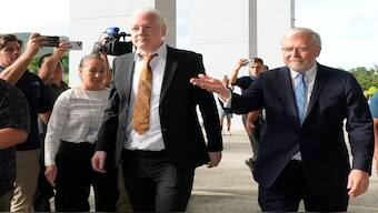 WikiLeaks founder Julian Assange, center, arrives at the United States courthouse where he is expected enter a plea deal in Saipan, Mariana Islands. AP