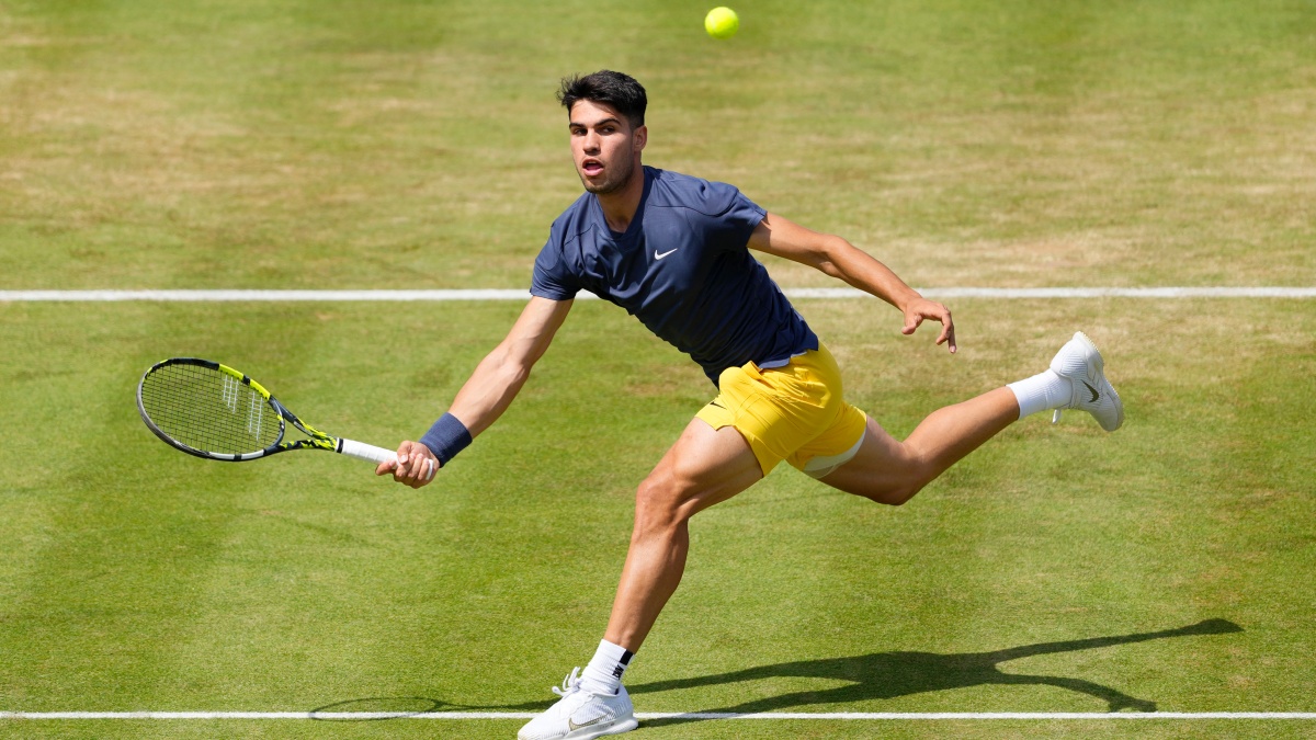 Carlos Alcaraz plays a return to Jack Draper during their men's singles match at The Queen's Club tennis tournament in London. AP Carlos Alcaraz plays a return to Jack Draper during their men's singles match at The Queen's Club tennis tournament in London. AP