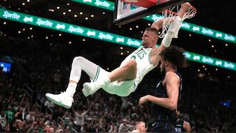 Boston Celtics center Kristaps Porzingis dunks next to Dallas Mavericks center Dereck Lively II, during the first half of Game 1 of NBA Finals. AP
