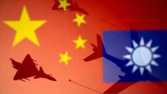 Chinese and Taiwanese national flags are displayed alongside military airplanes in this illustration. File image/Reuters