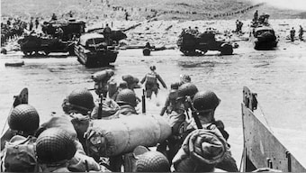 American soldiers and supplies arrive on the shore of the French coast of German-occupied Normandy during the Allied D-Day invasion on 6 June, 1944 in World War II. Nearly 160,000 Allied troops landed in Normandy on the day. Of those, 73,000 were from the United States, 83,000 from Britain and Canada. Forces from several other countries were also involved, including French troops. The Allies faced around 50,000 German forces. File Image/AP