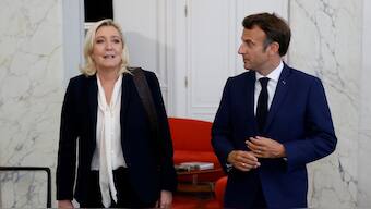French far-right Rassemblement National (RN) leader and Member of Parliament Marine Le Pen is escorted by France's President Emmanuel Macron after talks at the presidential Elysee Palace, France. File Image/Reuters