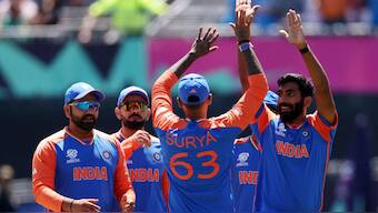 The Indian players celebrate Jasprit Bumrah's dismissal of Pakistan captain Babar Azam. Reuters