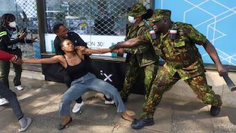 Police officers arrest a demonstrator protesting against proposed tax hikes in a finance bill that is to be tabled in parliament in Nairobi, Kenya. AP 