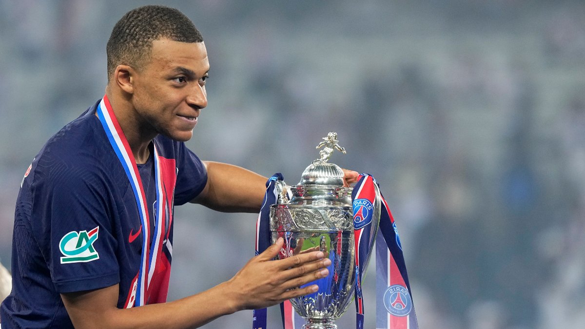 Kylian Mbappe poses with the winner's trophy after helping Paris Saint-Germain win the French Cup in his final appearance for the club. AP Kylian Mbappe poses with the winner's trophy after helping Paris Saint-Germain win the French Cup in his final appearance for the club. AP