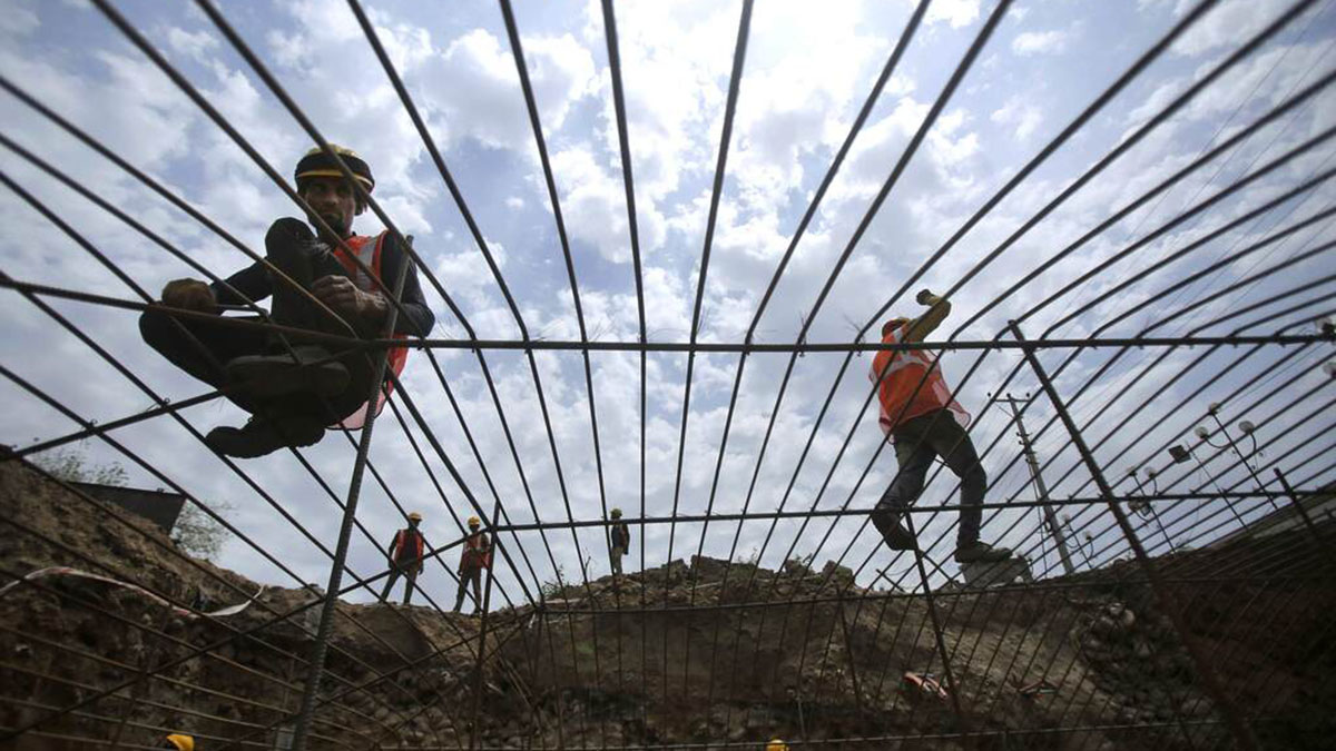 (File) Indian labourers work at construction site in Jammu. AP (File) Indian labourers work at construction site in Jammu. AP