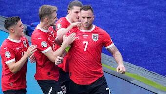 Austria's Marko Arnautovic, right, is celebrated by his teammates after scoring his side's third goal from the penalty spot during a Group D match between Poland and Austria at the Euro 2024. AP