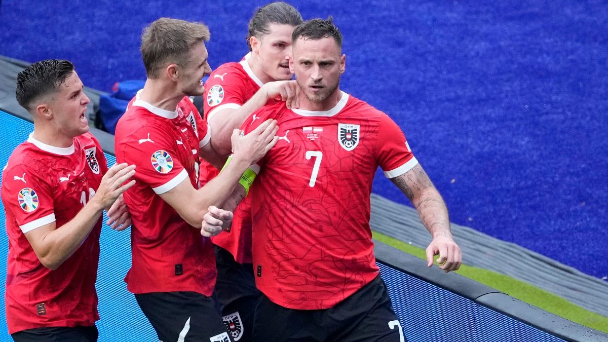 Austria's Marko Arnautovic, right, is celebrated by his teammates after scoring his side's third goal from the penalty spot during a Group D match between Poland and Austria at the Euro 2024. AP Austria's Marko Arnautovic, right, is celebrated by his teammates after scoring his side's third goal from the penalty spot during a Group D match between Poland and Austria at the Euro 2024. AP