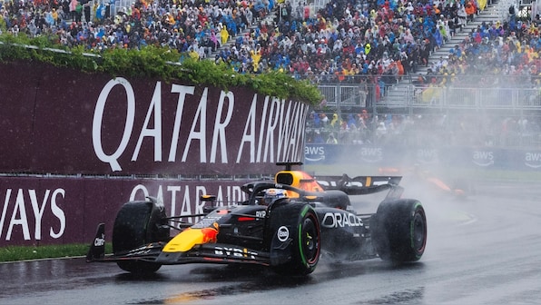  Max Verstappen wins 'crazy' rain-hit race