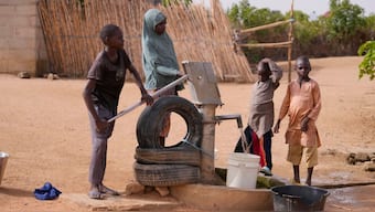People fetch water at a borehole in Kaltungo Poshereng, Nigeria. AP