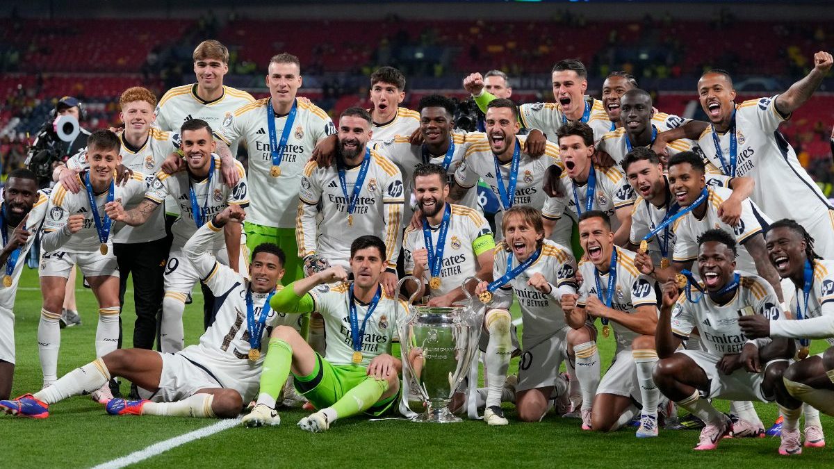 Real Madrid's players pose with the trophy after winning the Champions League final against Borussia Dortmund. AP Real Madrid's players pose with the trophy after winning the Champions League final against Borussia Dortmund. AP
