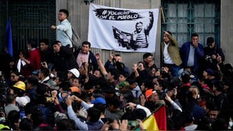 Supporters of Bolivian President Luis Arce crowd into Plaza Murillo in La Paz, Bolivia, Wednesday, June 26, 2024. Armored vehicles rammed the doors of Bolivia's government palace located in Plaza Murillo, in an apparent coup attempt on Wednesday against Arce, but he vowed to stand firm and named a new army commander who ordered troops to stand down. Photo- AP
