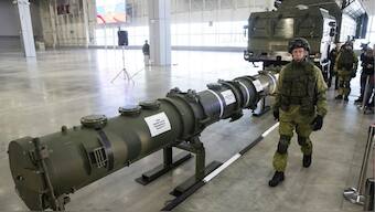 A Russian military officer walks past the 9M729 land-based cruise missile on display in Kubinka outside Moscow, Russia, on Jan. 23, 2019. File Photo- AP