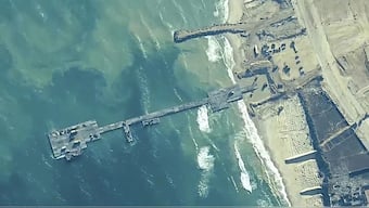 FILE - The image provided by U.S, Central Command, shows U.S. Army soldiers assigned to the 7th Transportation Brigade (Expeditionary), U.S. Navy sailors assigned to Amphibious Construction Battalion 1, and Israel Defense Forces placing the Trident Pier on the coast of Gaza Strip on May 16, 2024. - AP