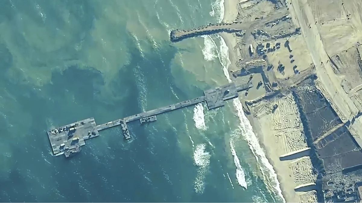 FILE - The image provided by U.S, Central Command, shows U.S. Army soldiers assigned to the 7th Transportation Brigade (Expeditionary), U.S. Navy sailors assigned to Amphibious Construction Battalion 1, and Israel Defense Forces placing the Trident Pier on the coast of Gaza Strip on May 16, 2024. - AP FILE - The image provided by U.S, Central Command, shows U.S. Army soldiers assigned to the 7th Transportation Brigade (Expeditionary), U.S. Navy sailors assigned to Amphibious Construction Battalion 1, and Israel Defense Forces placing the Trident Pier on the coast of Gaza Strip on May 16, 2024. - AP