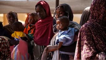 A handout photograph, shot in January 2024, shows women and babies at the Zamzam displacement camp, close to El Fasher in North Darfur, Sudan. Reuters