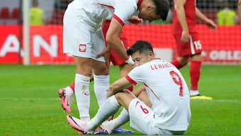 Poland's Robert Lewandowski, bottom, reacts during the international friendly match between Poland and Turkey at the National stadium in Warsaw, Poland. AP