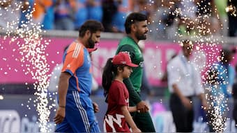 India captain Rohit Sharma and Pakistan counterpart Babar Azam walk out to the centre ahead of their T20 World Cup Group A clash in New York. AP