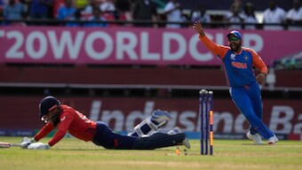 India captain Rohit Sharma celebrates after England's Adil Rashid is run-out thanks to a direct hit by Suryakumar Yadav during the second semi-final of the T20 World Cup in Guyana. AP