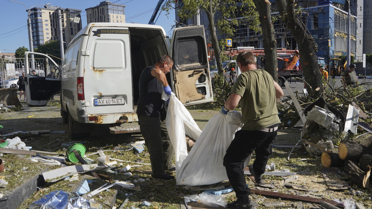 Municipal workers carry a dead body killed after an apartment building was hit by Russian air bomb killing at least three and injuring 23, in Kharkiv, Ukraine on 22 June, 2024. AP Municipal workers carry a dead body killed after an apartment building was hit by Russian air bomb killing at least three and injuring 23, in Kharkiv, Ukraine on 22 June, 2024. AP