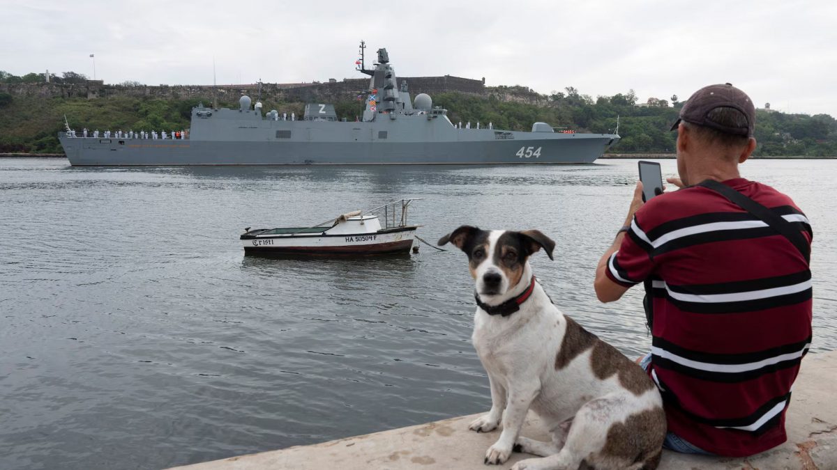 A man sits with his dog as Russian frigate Admiral Gorshkov enters Havana’s bay, Cuba, June 12. Source: REUTERS A man sits with his dog as Russian frigate Admiral Gorshkov enters Havana’s bay, Cuba, June 12. Source: REUTERS