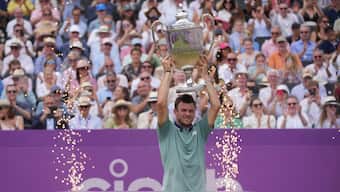 Tommy Paul celebrates after beating Lorenzo Musetti to win the Queen's Club tennis tournament in London. AP