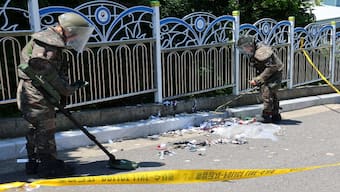 South Korean soldiers examine various objects including what appeared to be trash from a balloon believed to have been sent by North Korea, in Incheon, South Korea, on 2 June, 2024. Reuters File