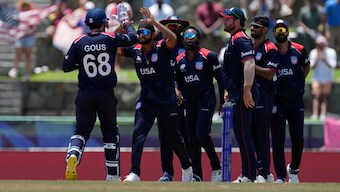USA's Harmeet Singh (second from left) celebrates with teammates after dismissing South Africa's David Miller during their T20 World Cup Super 8 clash in Antigua. AP