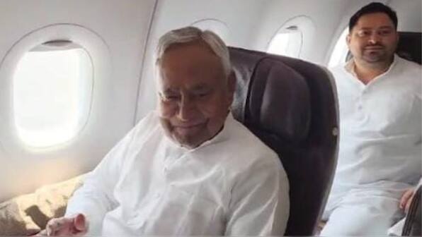 WATCH: NDA's Nitish Kumar & INDI Alliance's Tejashwi Yadav fly on same flight to Delhi for govt formation meet