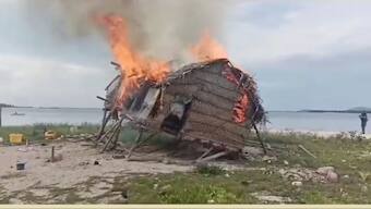 Smoke rises as a house is demolished in Tun Sakaran Marine Park, Sabah, Malaysia, in this screen grab obtained from a social media video, released on June 4, 2024. Video obtained by Reuters
