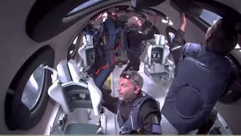  Giorgio Manenti of Italy looks out a window as Virgin Galactic's Galactic 07 mission carries four Turkish, U.S. and Italian passengers to the edge of space and back aboard its spaceplane on a flight lasting slightly more than an hour, originating from Spaceport America near Truth or Consequences, New Mexico, U.S. June 8, 2024 in a still image from a video.