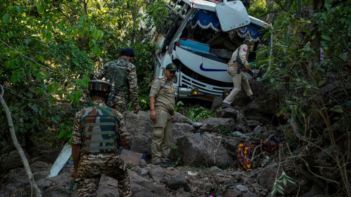 (File) Security men inspect a bus that fell into a deep gorge on Sunday after it was fired at by suspected militants in Reasi district, Jammu and Kashmir, on 10 June 2024. AP (File) Security men inspect a bus that fell into a deep gorge on Sunday after it was fired at by suspected militants in Reasi district, Jammu and Kashmir, on 10 June 2024. AP