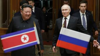 Russian President Vladimir Putin, right, and North Korea's leader Kim Jong Un smile during their meeting at the Pyongyang Sunan International Airport outside Pyongyang, North Korea on 19 June 2024. AP
