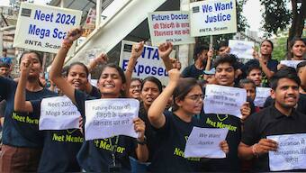 Students raise slogans during a protest over the alleged irregularities in NEET 2024 results, in Bhopal, 14 June 2024. PTI File Photo