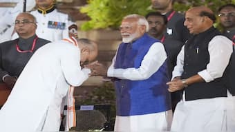 Prime Minister Narendra Modi being greeted by Amit Shah at the swearing-in ceremony of the new Union government, at Rashtrapati Bhavan in New Delhi. Modi has retained Shah, Rajnath Singh, Nirmala Sitharaman and S Jaishankar in their previous roles. PTI
