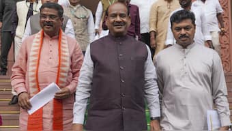 BJP MP Om Birla, NDA candidate for Speaker post, with Union Minister Dharmendra Pradhan and others at the Parliament House complex during the first session of 18th Lok Sabha, in New Delhi on Tuesday. PTI
