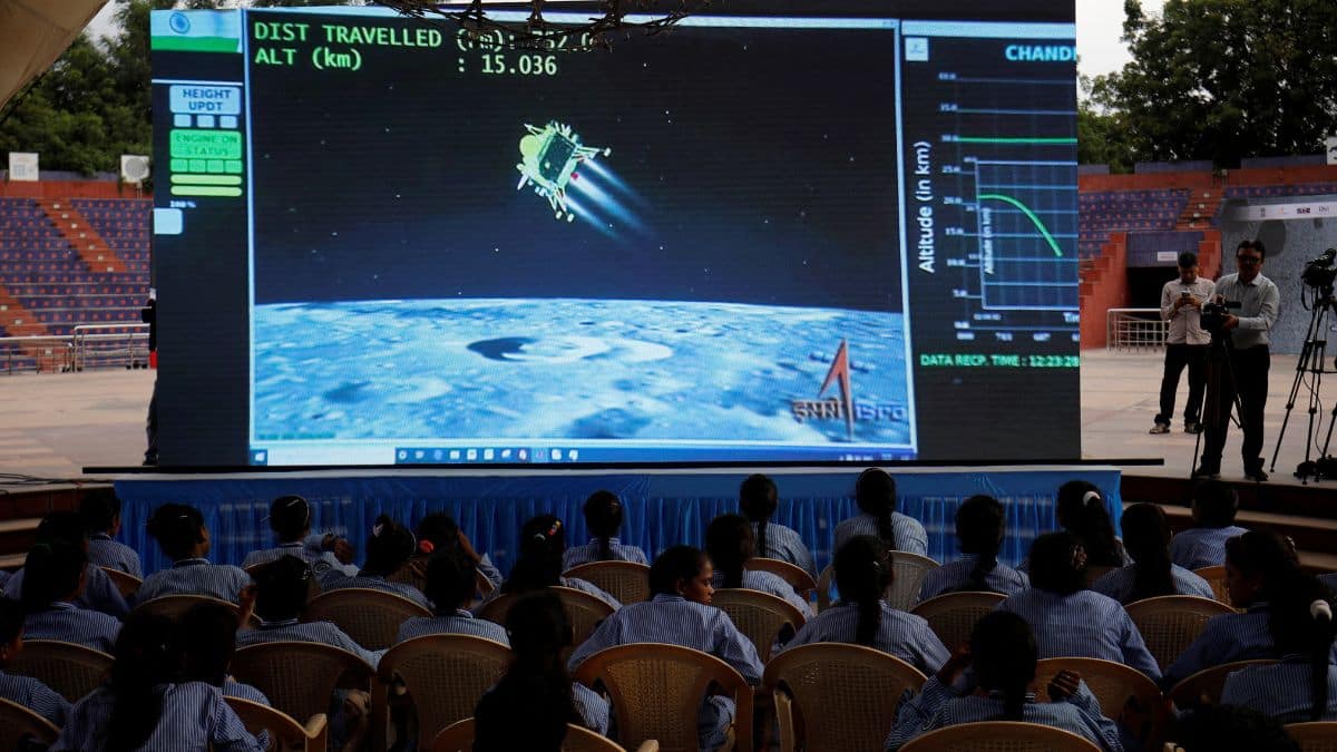 People watch a live stream of Chandrayaan-3 spacecraft's landing on the moon, inside an auditorium of Gujarat Science City in Ahmedabad, 23 August, 2023. Reuters