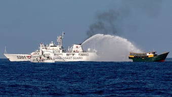 Chinese Coast Guard vessels fire water cannons towards a Philippine resupply vessel as it made its way to the Second Thomas Shoal in the South China Sea, 4 March, 2024. File Image/Reuters