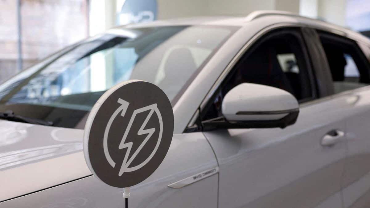 An energy recharge sign is seen next to a BYD Atto 3 car in a BYD Auto company and Autotorino store in Milan, Italy, 20 March, 2024. File Image/Reuters
