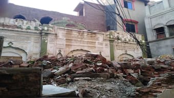 , debris remains from an Ahmadi mosque that was demolished by an angry mob on May, 24, 2018. Source; File Image / AP
