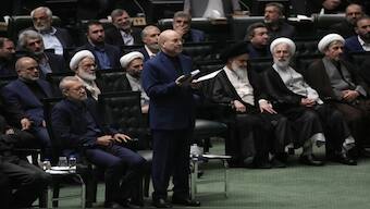 Mohammad Bagher Qalibaf, center, takes an oath during the opening ceremony of the new parliament term in Tehran. Source: File Image / AP