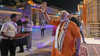 Indian Prime Minister Narendra Modi greets supporters at Kashi Vishwanath Temple after his roadshow in Varanasi, India, Monday, May 13, 2024. (AP Photo/Rajesh Kumar)