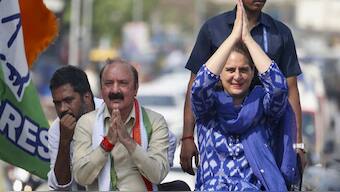 Congress leader Priyanka Gandhi Vadra with the party’s candidate from Amethi constituency Kishori Lal Sharma during an election roadshow for the Lok Sabha polls, in Amethi district. File photo/PTI