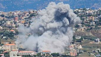 Smoke rises from the southern Lebanese town of Khiam, amid ongoing cross-border hostilities between Hezbollah and Israeli forces, as pictured from the town of Qlayaa, southern Lebanon June 25, 2024. File Image / Reuters