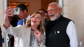 Italian prime minister Giorgia Meloni takes a selfie with PM Narendra Modi on the sidelines of the G7 summit, in Apulia, Italy, on Friday. PTI
