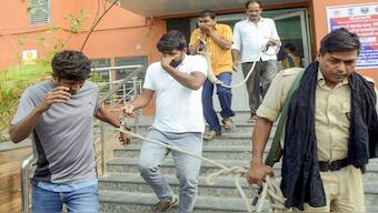 Bihar's Economic Offences Unit (EOU) personnel leave with the accused arrested in connection with the alleged irregularities in NEET-UG exams 2024 case, after the latter's medical examination at LNJP hospital, in Patna. PTI