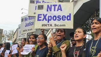 Students raise slogans during a protest over the alleged irregularities in NEET 2024 results, in Bhopal, Friday. PTI