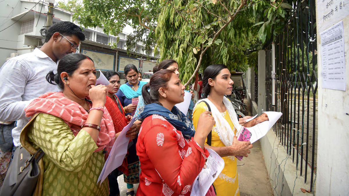 Aspirants search their roll numbers for seats before entering an examination centre to appear in the UGC-NET exam, at AN college in Patna, on 18 June. The exam has not been cancelled by the government. PTI Aspirants search their roll numbers for seats before entering an examination centre to appear in the UGC-NET exam, at AN college in Patna, on 18 June. The exam has not been cancelled by the government. PTI