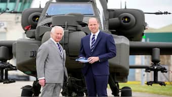 Britain's King Charles III officially hands over the role of Colonel-in-Chief of the Army Air Corps to Prince William, Prince of Wales, in front of a helicopter at the Army Aviation Centre in Middle Wallop, Britain May 13, 2024. Reuters
